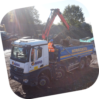 A Norris grab lorry being operated by a member of the Norris team