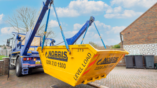 skip collection A skip being lifted onto a lorry